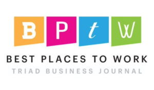 White letters separated by different colored boxes reading "BPTW" with text underneath saying "Best Places to Work Triad Business Journal"
