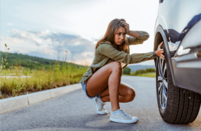 Woman with a broken down car