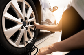 Woman fills up a tire